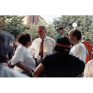 Mayor Flynn talking with Inquilinos Boricuas en Acción staff at the 1998 Festival Betances.