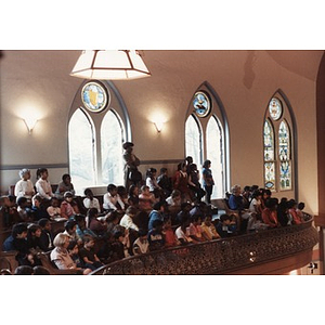 Audience of school children watches a performance from the balcony at the Jorge Hernandez Cultural Center.