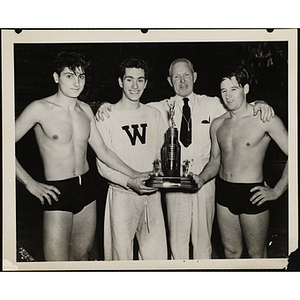 From left to right, John Masso, Joe Prato, Hal Ulen, and Leo Gamon, posing with their trophy in the New England Boys' Clubs Swimming Championship