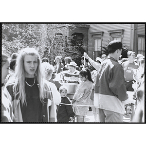 Children and adults waiting around a cotton candy stand at the Boys and Girls Clubs of Boston 100th Anniversary Celebration Street Fair