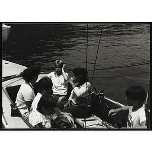 A Group of youth sitting in a sailboat