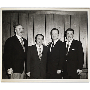 State Senator John E. Powers, second from left, posing with three unidentified men at a Boys' Clubs of Boston awards event