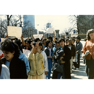 Demonstrators stand outside the Massachusetts State House at a rally for bilingual education in schools and urge legislators to vote No on Bill 882