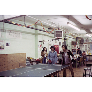 Players at Chinese Progressive Association International Women's Day ping-pong tournament