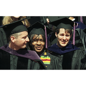 Smiling School of Law graduates at the commencement ceremony for the Class of 1997