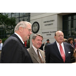 Three men stand together at the Veterans Memorial groundbreaking ceremony