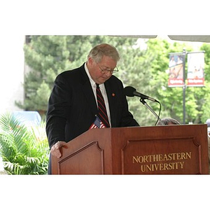 Neal Finnegan speaks from the podium at the Veterans Memorial groundbreaking ceremony