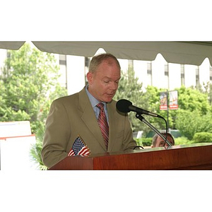 A man stands at the podium speaking at the Veterans Memorial groundbreaking ceremony