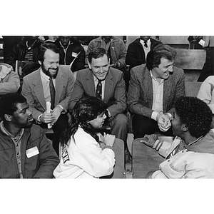 Richard Lapchick, Raymond Flynn, and Phil Esposito speaking with children