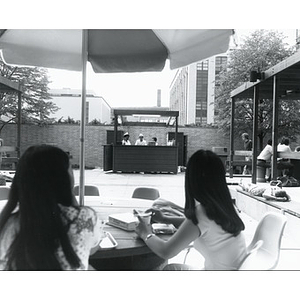 Students sitting outside of the Ell Student Center