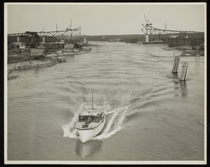 Ship passing under the Bourne Bridge during its construction