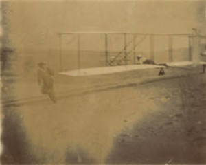 Dan Tate and the Wright brothers launching the Wright 1903 glider, Outer Banks, North Carolina