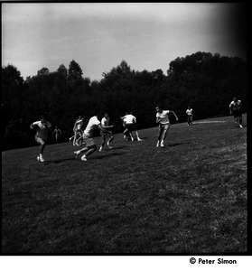 Camp Arcadia: campers playing touch football (running around the end)