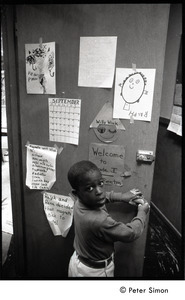 Young boy at the classroom door, Liberation School