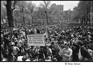 Kent State Shooting Demonstration at the Boston State House: protestors gathered on Boston Common, counter-protestor in middle holding a picket sign