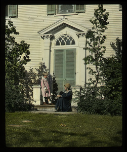 Hulot House, South Amherst: Woman and child on stoop