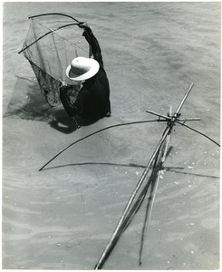 Fishermen ply their nets