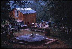 Rear view of house, laundry, and makeshift table, Johnson Pasture Commune