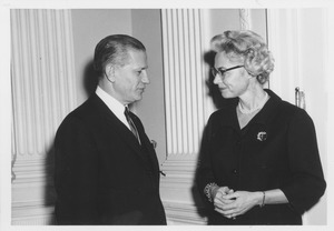 Carolyn C. Rowland talking with unidentified man