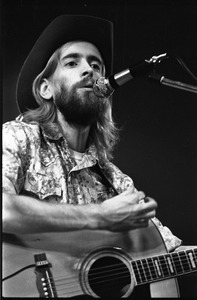 New Riders of the Purple Sage opening for the Grateful Dead at Sargent Gym, Boston University: John 'Marmaduke' Dawson playing acoustic guitar and signing