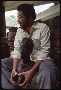 Bill Withers: Withers surrounded by African sculpture and cupping the breasts of a bust