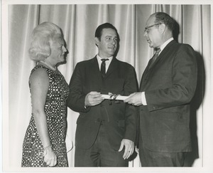 Margaret Milbank Bogert with Dr. Salvatore DiMichael and awardee on stage at Institute Day