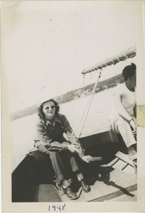Bernice Kahn holding the tiller of a sailboat