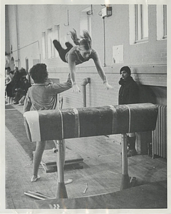 Mimi Murray helping gymnast on vault