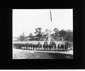 Boys around flag pole