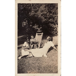 Inez Irving and friends recline on the lawn