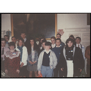 A group of boys and girls standing in front of a wall at the "Recognition Dinner at Harvard Club"