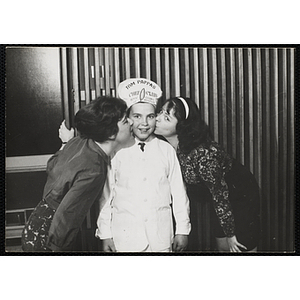 A member of the Tom Pappas Chefs' Club poses for a candid shot with two women