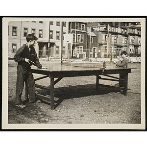 Two boys play table tennis on the Charles Hayden Playground in South Boston