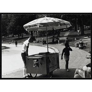 A teenage boy operates an ice juice cart on Boston Common