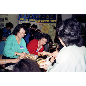 Guests at a Chinese Progressive Association meeting on unemployment