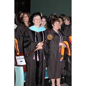 Faculty member and students at School of Nursing convocation