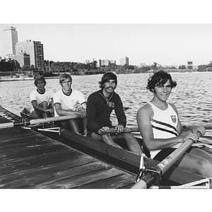 Four members of the bronze medal crew team on the Charles River