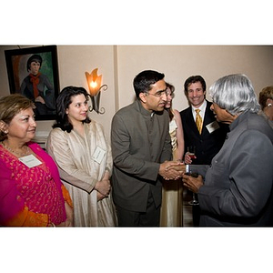 Dr. A. P. J. Abdul Kalam shaking hands with a guest at a reception