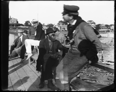 Group of men landing, Gloucester Harbor