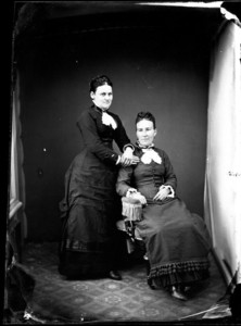 Portrait of two women; one seated, one standing