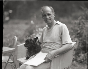 Arthur Guiterman, seated with Scottish terrier