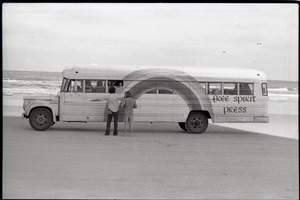 Free Spirit Press bus parked by ocean