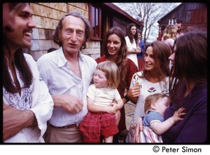 Stephen Lefebvre, unidentified man (with baby) and woman, Anna Laracou, and Catherine Blinder (with baby) at May Day celebration, Tree Frog Farm commune