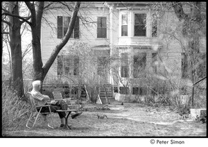 Ram Dass retreat at David McClelland's: older man smoking a pipe in his backyard, watching a squirrel