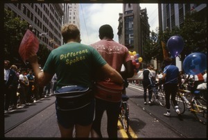 Men walking arm in arm at the San Francisco Pride Parade