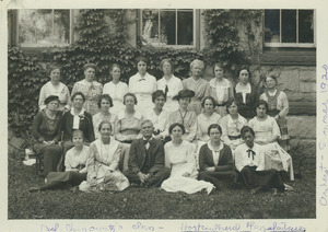 Walter Chenoweth sitting with his horticultural class of 23 women