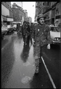Vietnam Veterans Against the War demonstration 'Search and destroy': veteran (W. B. Mabrin?) marching on the street, Combat Zone