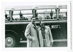 Photograph of two men and a bus