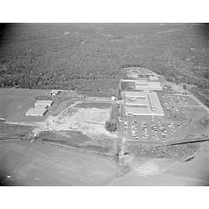 Suburban location of industrial buildings, some new construction, unidentified