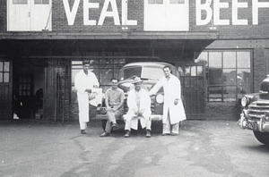 Charles Santos Jr. and employees in front of Santos and Sons Wholesale Meats
